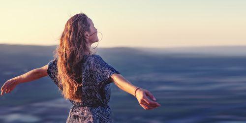 Woman experiencing renewed energy and resilience through holistic wellbeing care